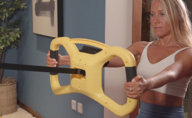 A woman uses Stealth Squat
