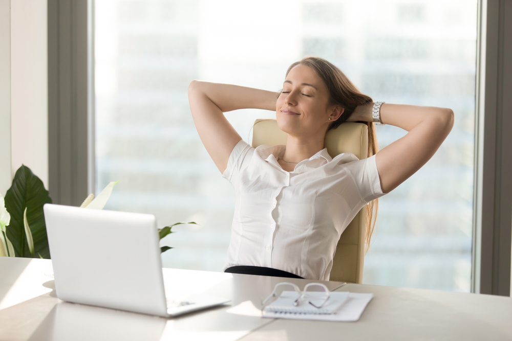 Businesswoman Relaxing in Office Chair