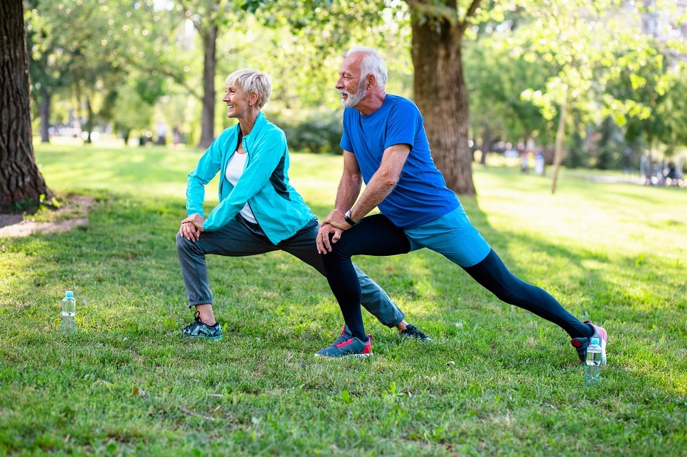 Happy,Fit,Senior,Couple,Exercising,In,Park.