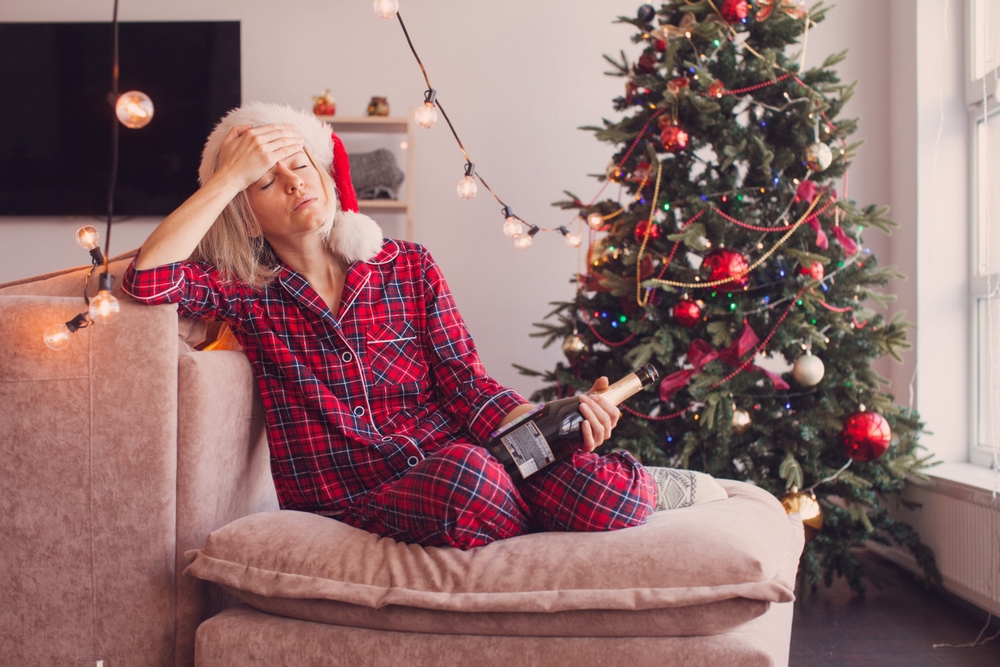Sad,Woman,Sitting,Near,The,Christmas,Tree.,Depressed,Female,Have