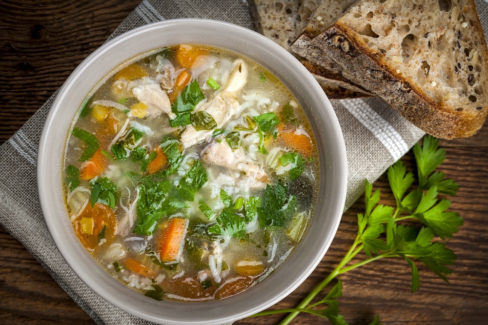Chicken,Rice,Soup,With,Vegetables,In,Bowl,And,Bread,From